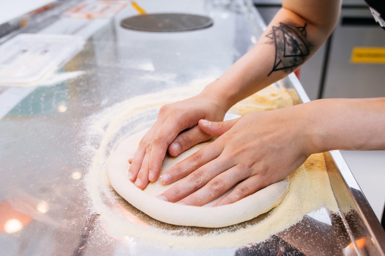 Why do we make pizza without gloves at Dodo Pizza?